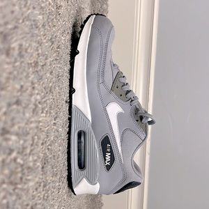 Gray and white Nike Air Maxs